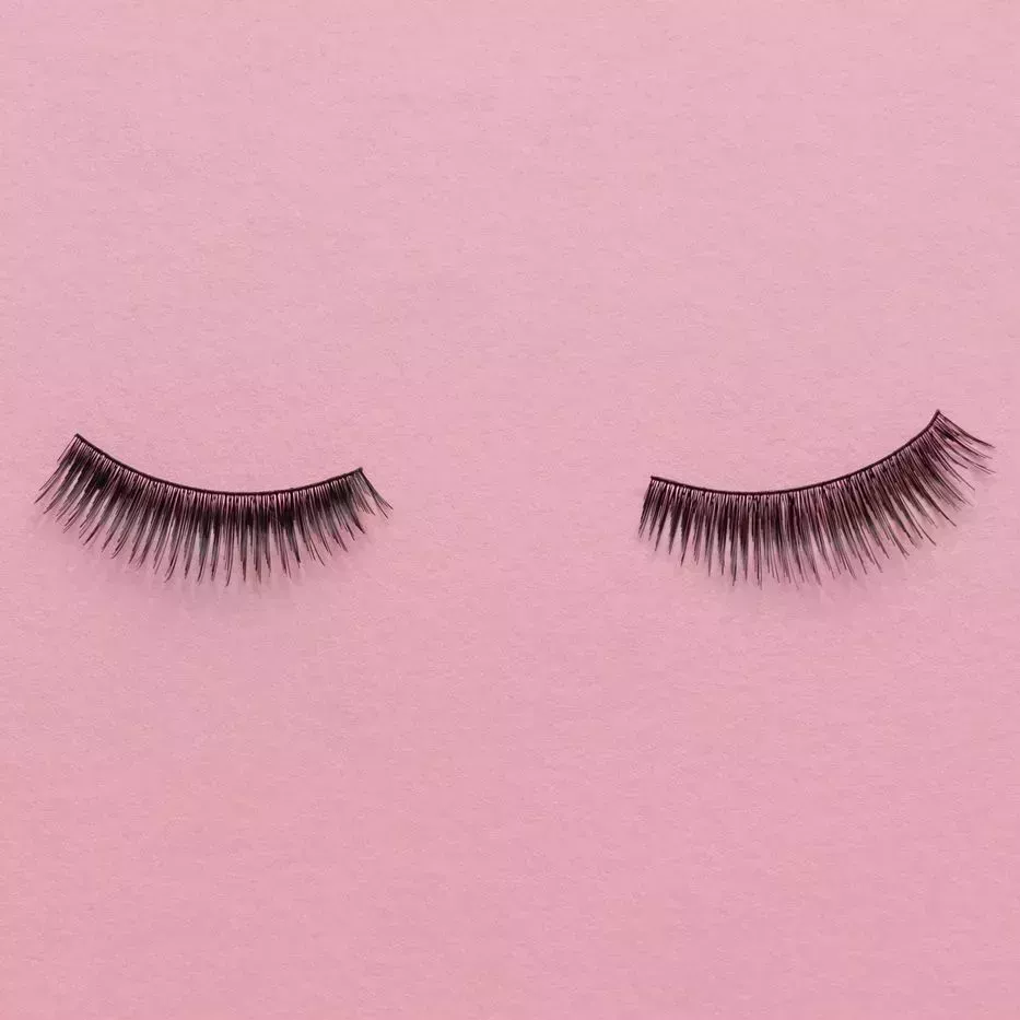 fake lashes on a pink background