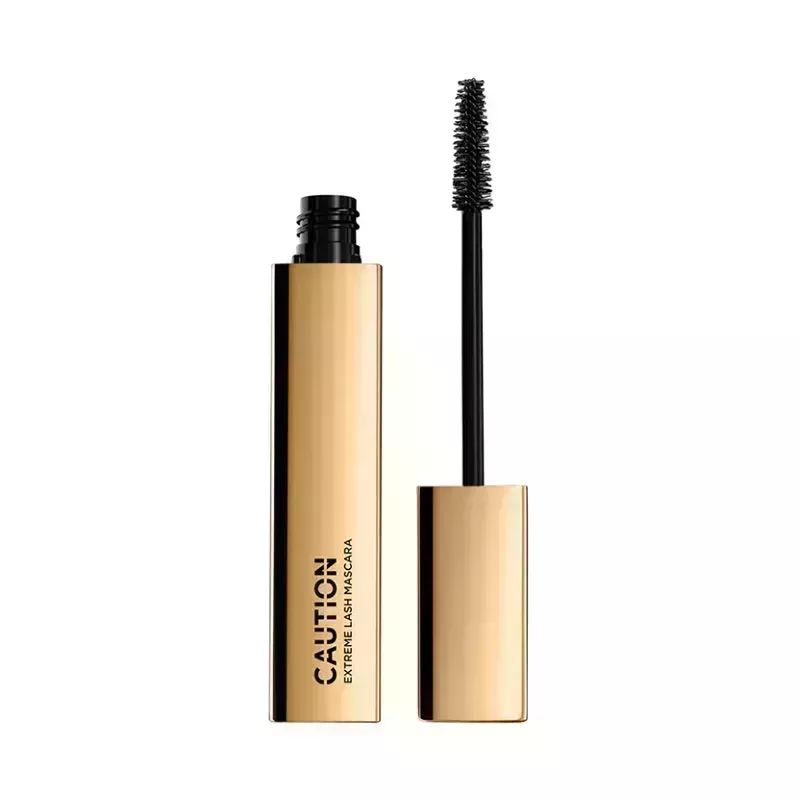 A gold mascara tube of the Hourglass Caution Extreme Lash Mascara on a white background