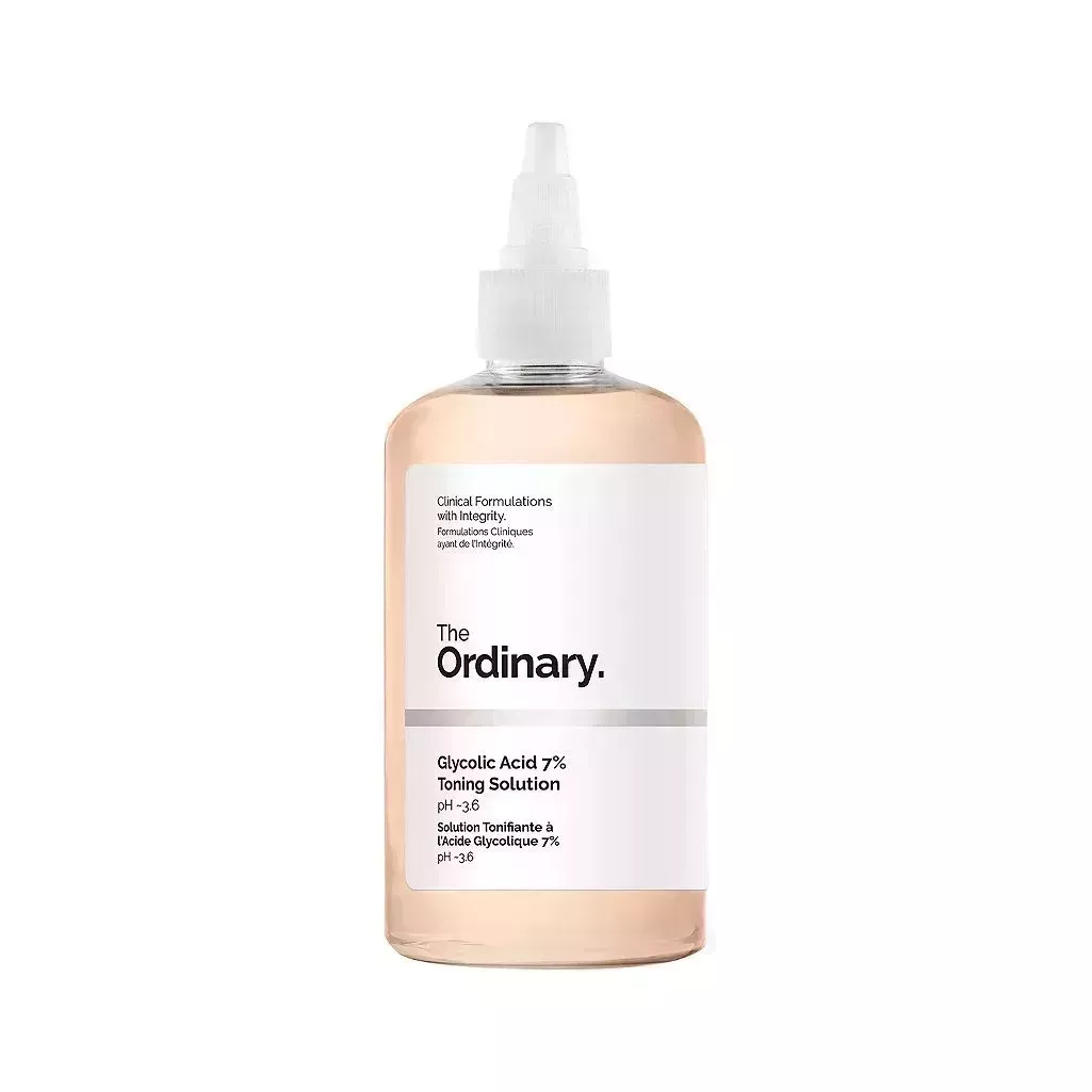 The Ordinary Glycolic Acid 7% Toning Solution transparent bottle of peach toner with white label and pointed tip cap on white background