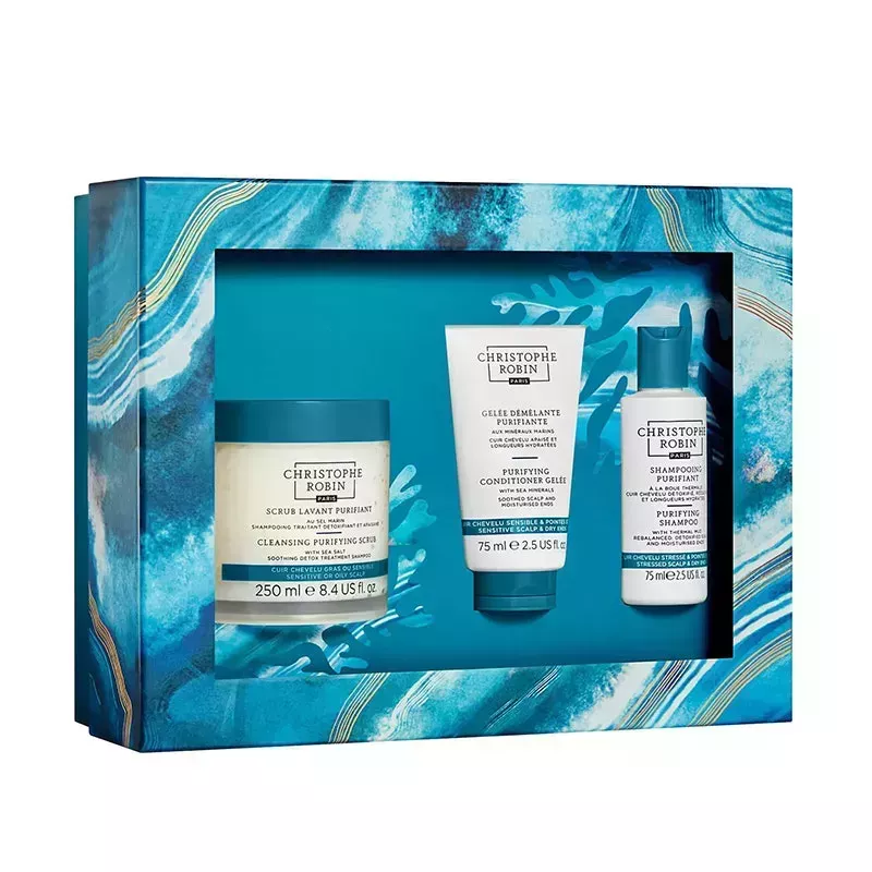 Christophe Robin New Hair Detox Ritual: A blue gift box filled with three Christophe Robin hair-care products on a white background