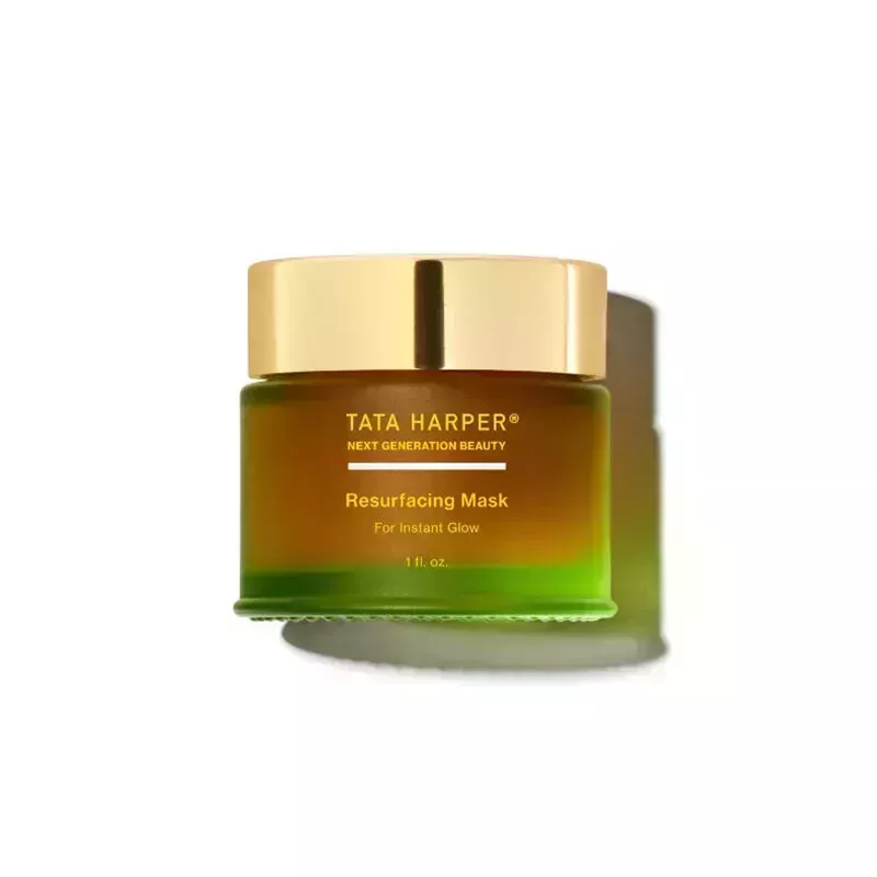 Tata Harper Resurfacing Mask: A green jar with yellow text and gold cap on a white background