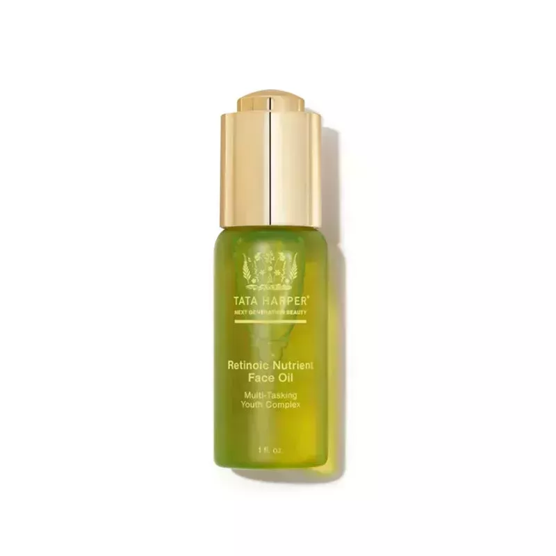 Tata Harper Retinoic Nutrient Face Oil: A green dropper bottle with yellow text and gold cap on a white background
