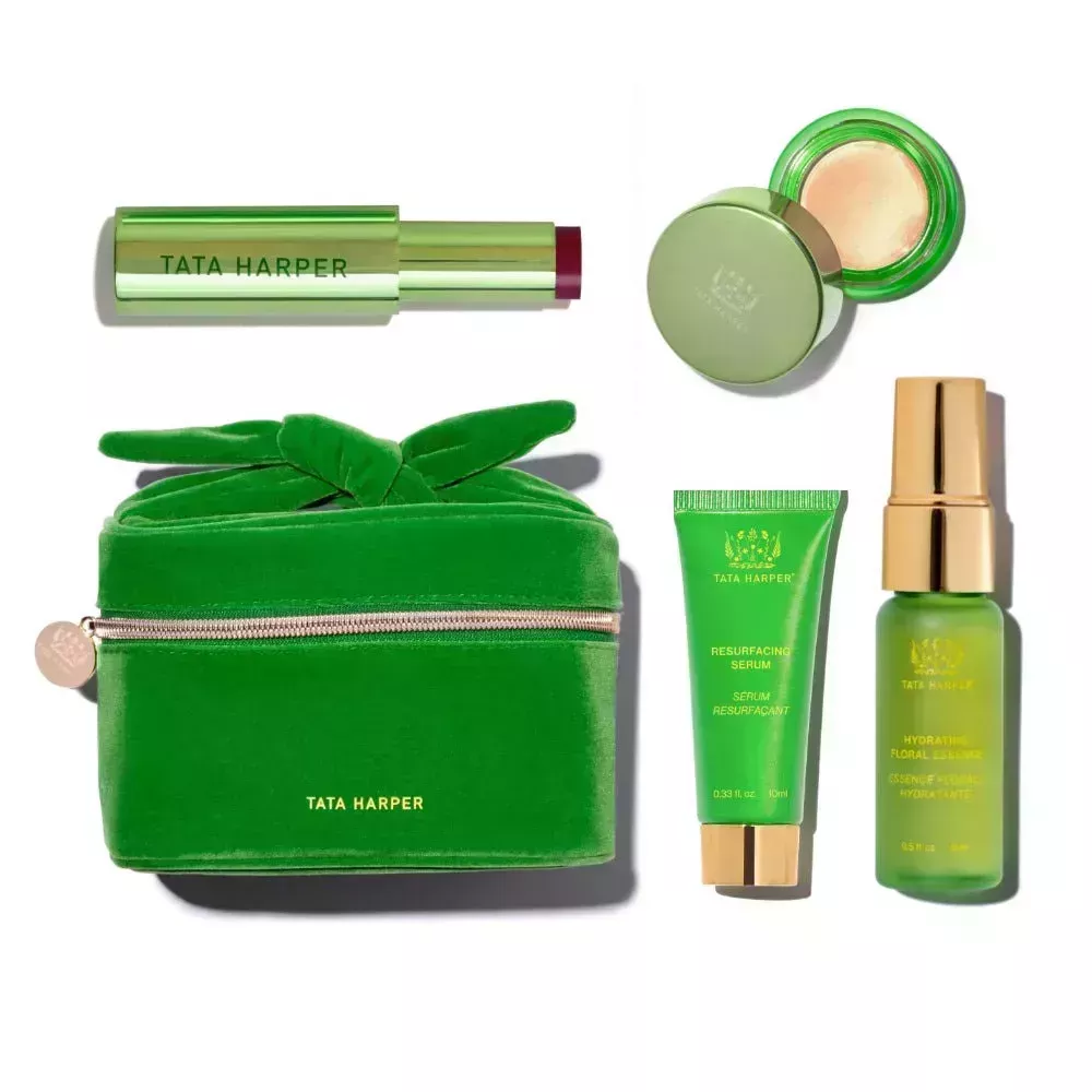 Cool Girl Holiday Kit set of green Tata Harper products and corduroy cosmetics bag on white background 