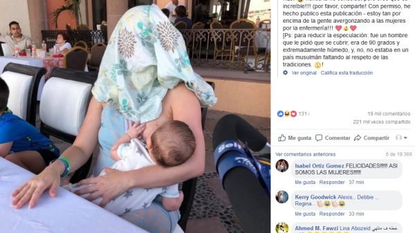 madre se tapa mientras da el pecho