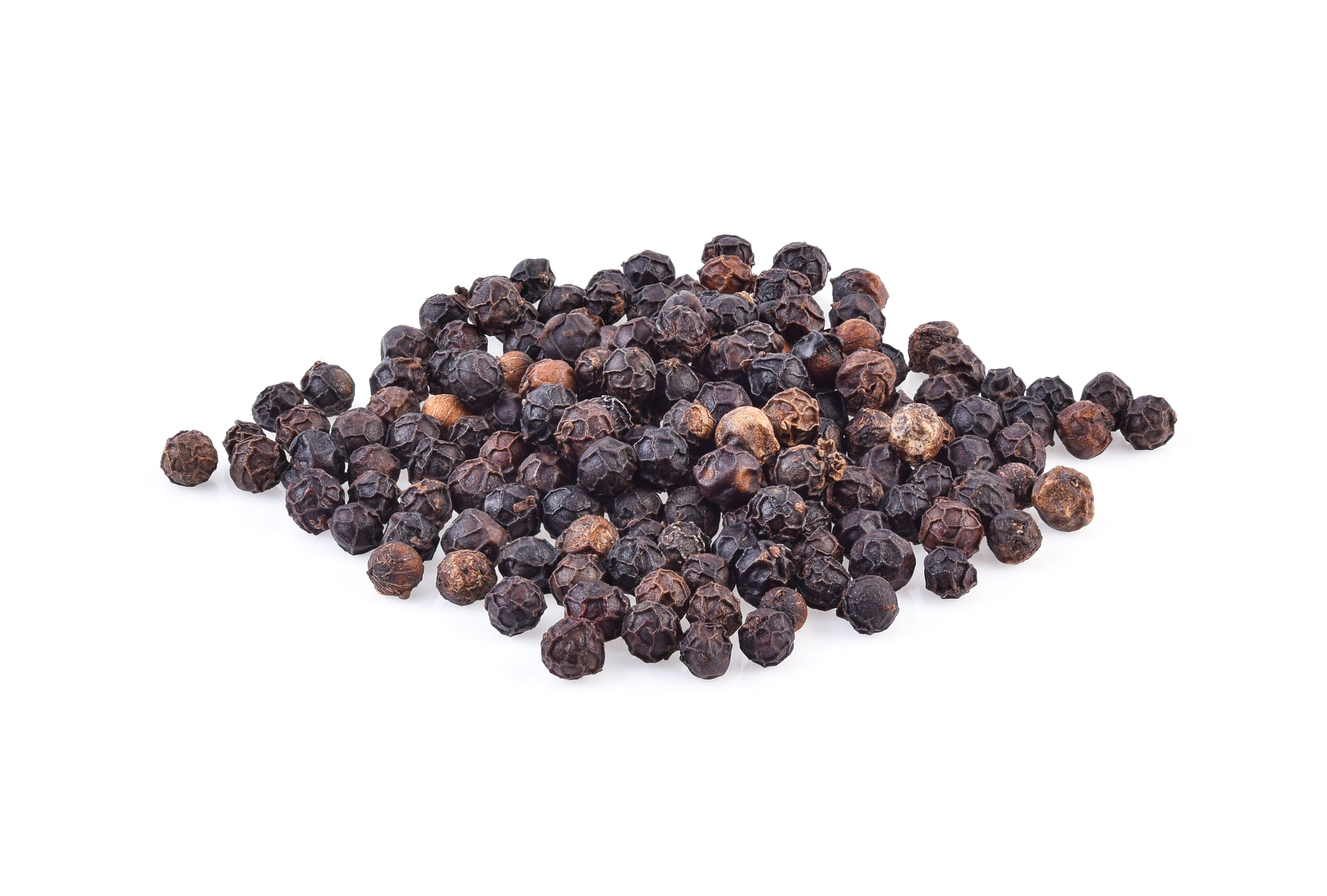 Close-Up Of Black Peppercorn On White Background