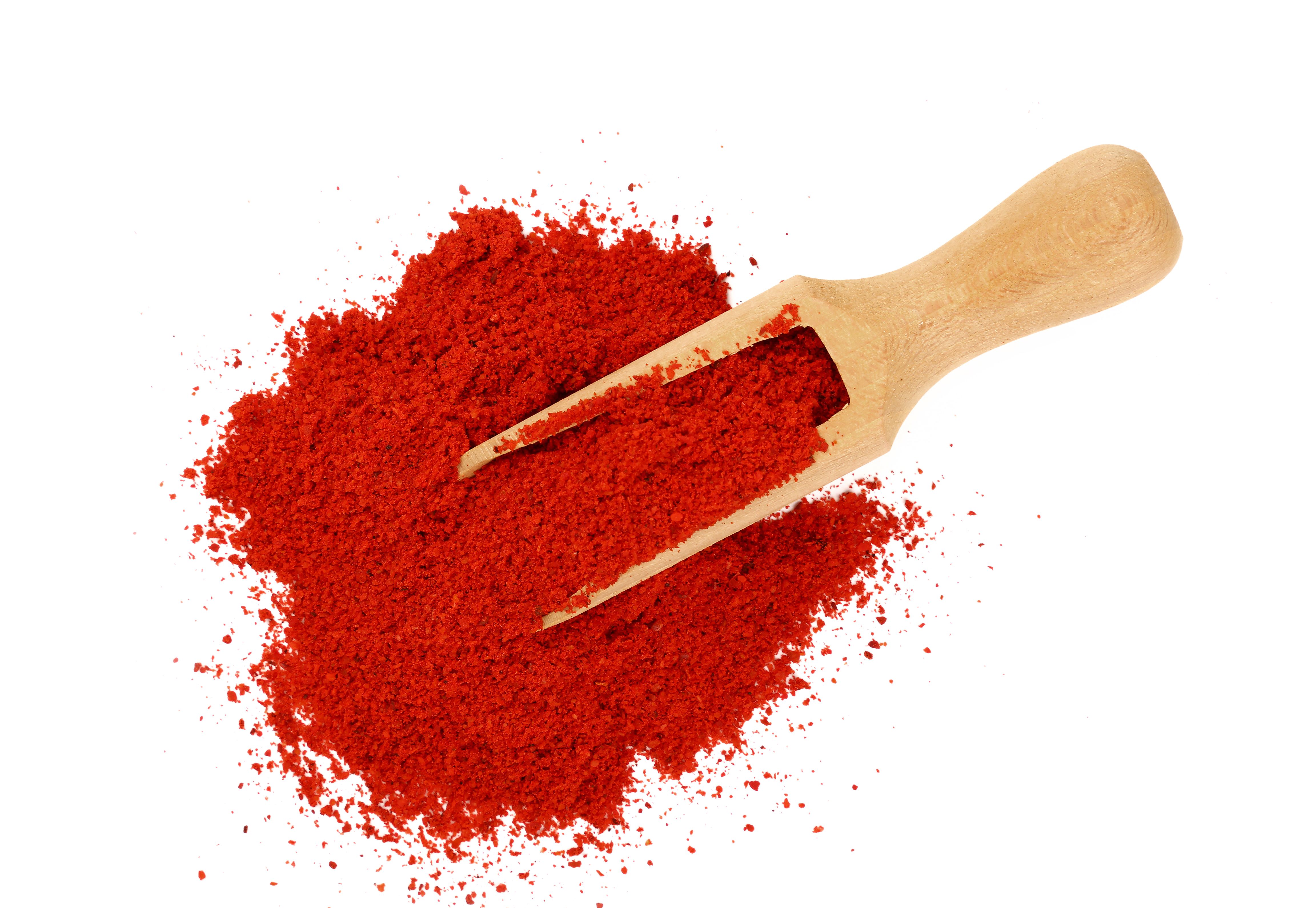Close-Up View Of Red Chili Pepper Against White Background