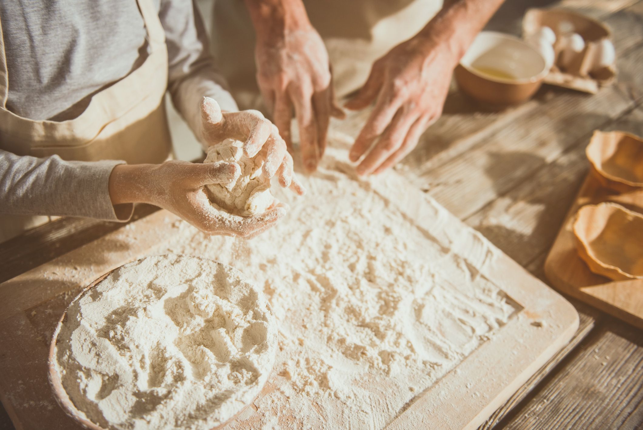 Kid forming pastry by hands