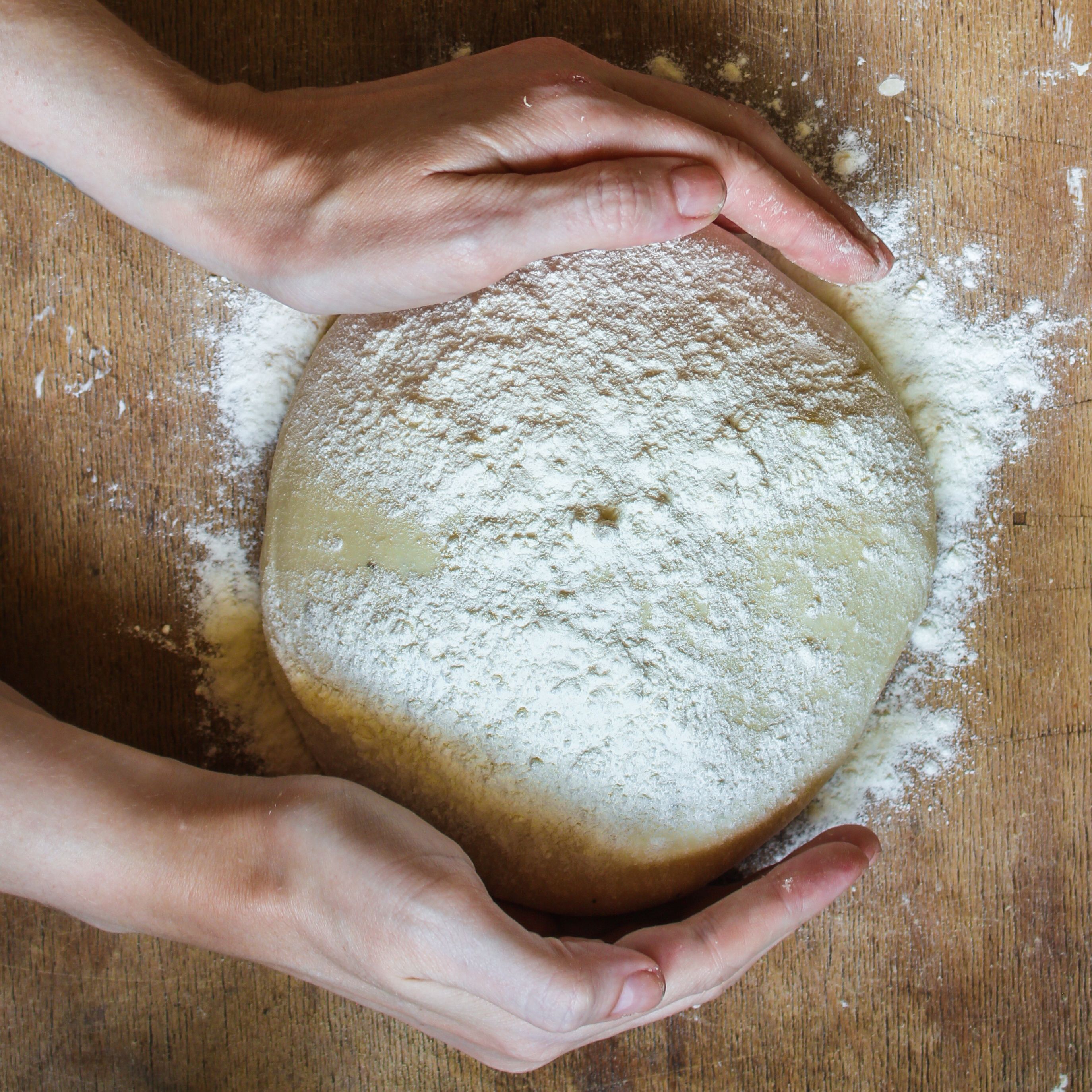 dough raw, flour, rolling pin for rolling (preparation for cooking) menu concept. food background. copy space