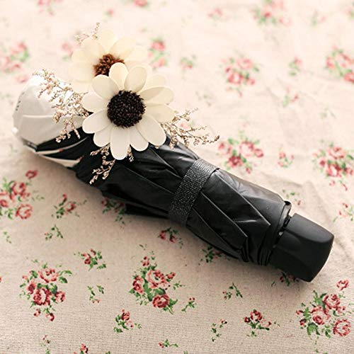 Paraguas de sol Plástico negro protector solar lluvia Parrilla de doble uso Paraguas de tres veces Súper fuerte Paraguas plegable anti-UV Chica viento Flor de sol Paraguas de cuatro colores Flor blan