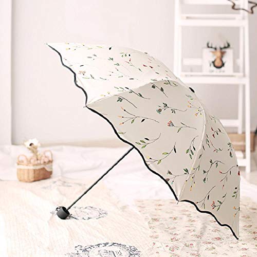 Paraguas de sol Plástico negro protector solar lluvia Parrilla de doble uso Paraguas de tres veces Súper fuerte Paraguas plegable anti-UV Chica viento Flor de sol Paraguas de cuatro colores Flor blan