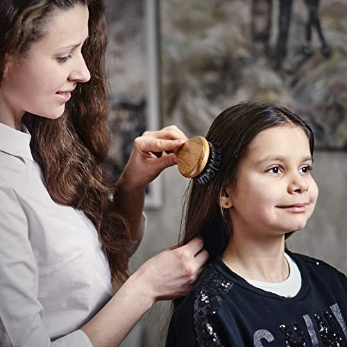 Cepillo para el pelo de bambú y cerdas de jabalí con alfileres para desenredar. Genial para desenredar el cabello. Los alfileres dirigen el pelo a las cerdas de jabalí, que vuelven el pelo sedoso.