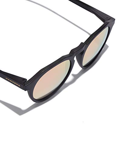 HAWKERS · Gafas de Sol Warwick Carbon Black, para Hombre y Mujer, un clásico renovado que combina montura en negro mate y lentes espejadas rosa dorado, Protección UV400