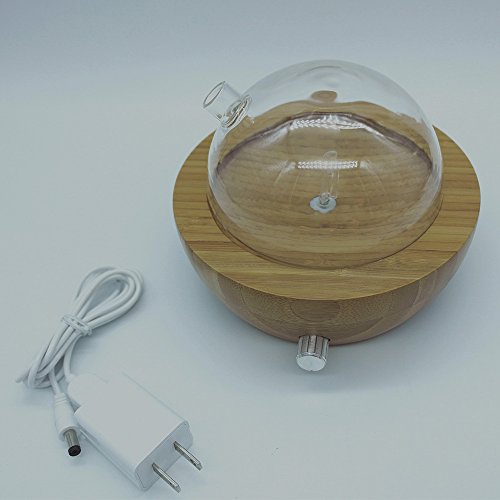 El difusor puro del aroma del aceite esencial de la nebulización de madera y del vidrio con colores cambió la luz, ninguÌ n calor, ninguna agua, ninguÌ n plástico