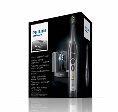 Philips HX6971/59 - Cepillo de dientes eléctrico, 31.000 movimientos/minuto, higienizador rayos UV con cargador, color negro