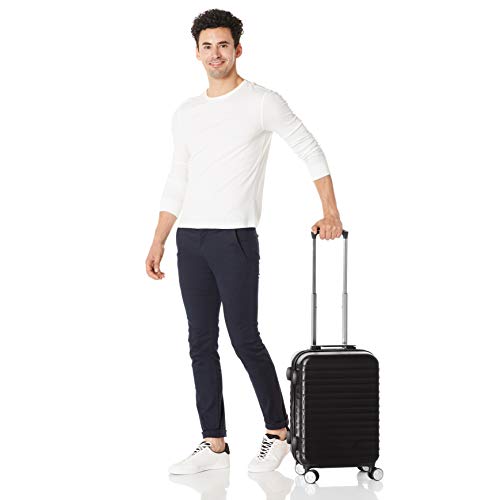 AmazonBasics - Maleta rígida giratoria prémium de 55 cm, negra