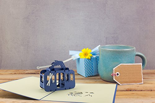 Carte postale pop up en 3D thème sports d'hiver et sports de montagne: idéal pour offrir un bon cadeau aux amateurs de ski, snowboard et randonnée en montagne. Parfait comme carte d'anniversaire.