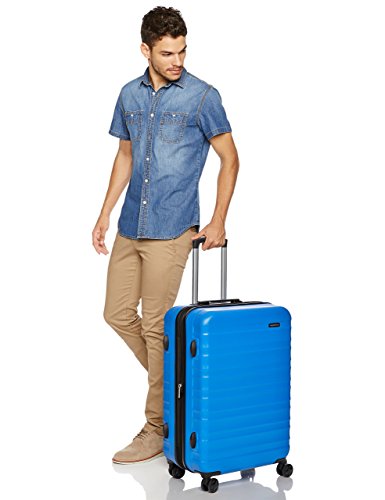 Amazon Basics - Maleta de viaje rígidaa giratoria - 68 cm, Azul claro