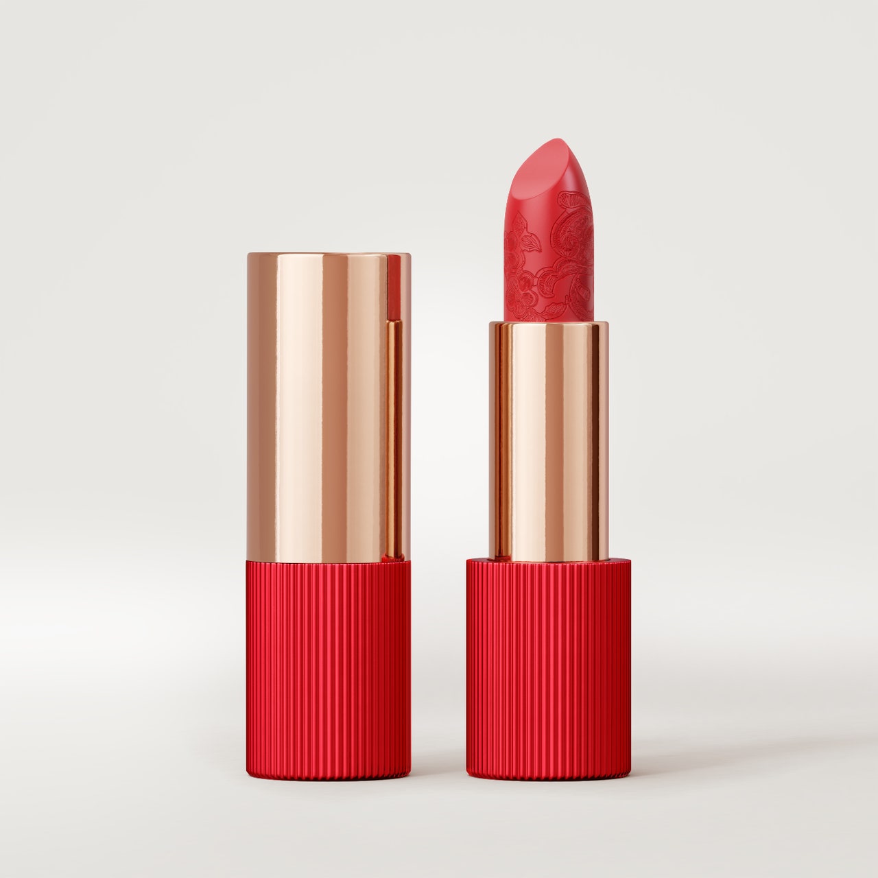 la perla beauty matte silk lipstick in coral on gray background