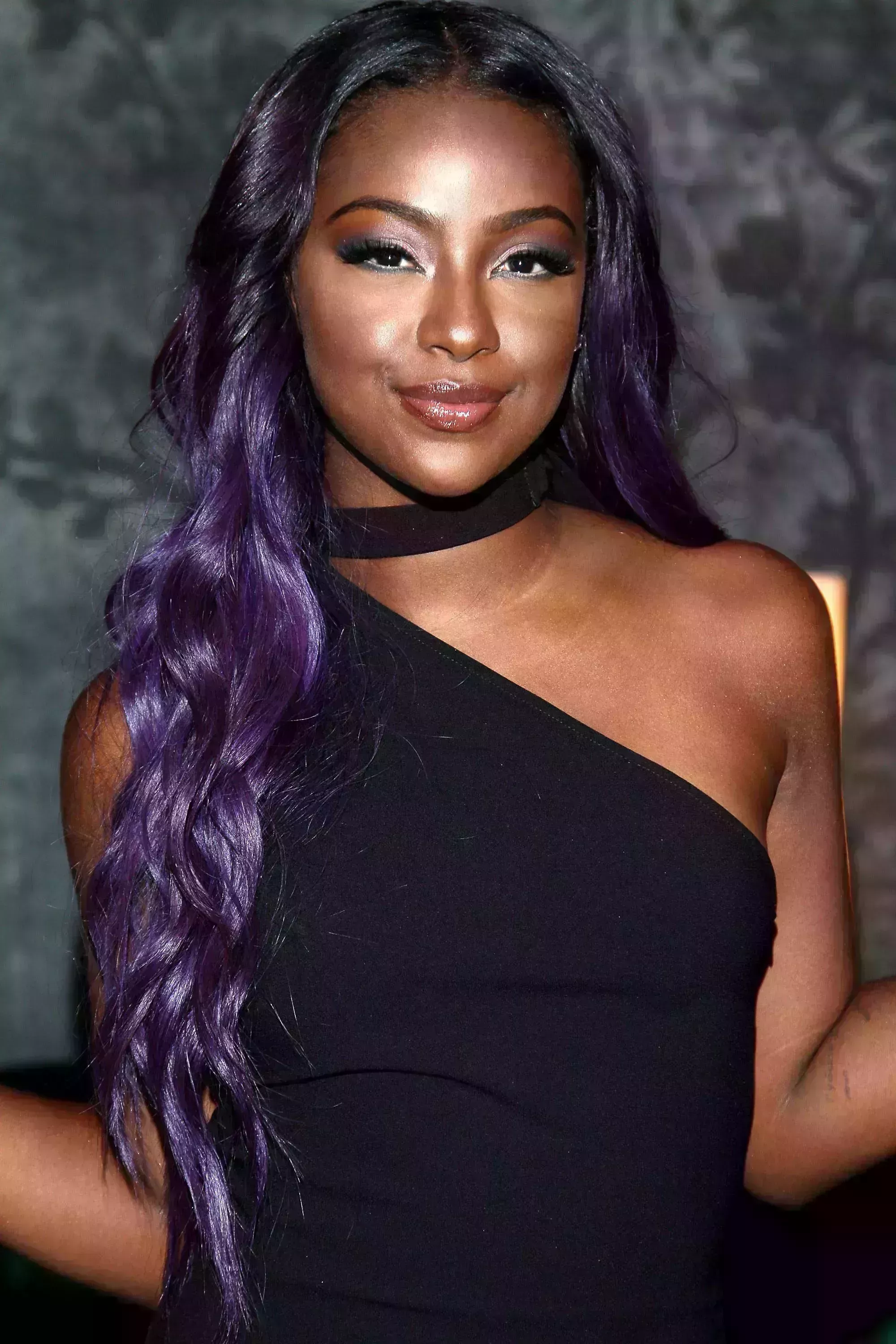 Justine Skye’s Black Hair with Purple Highlights