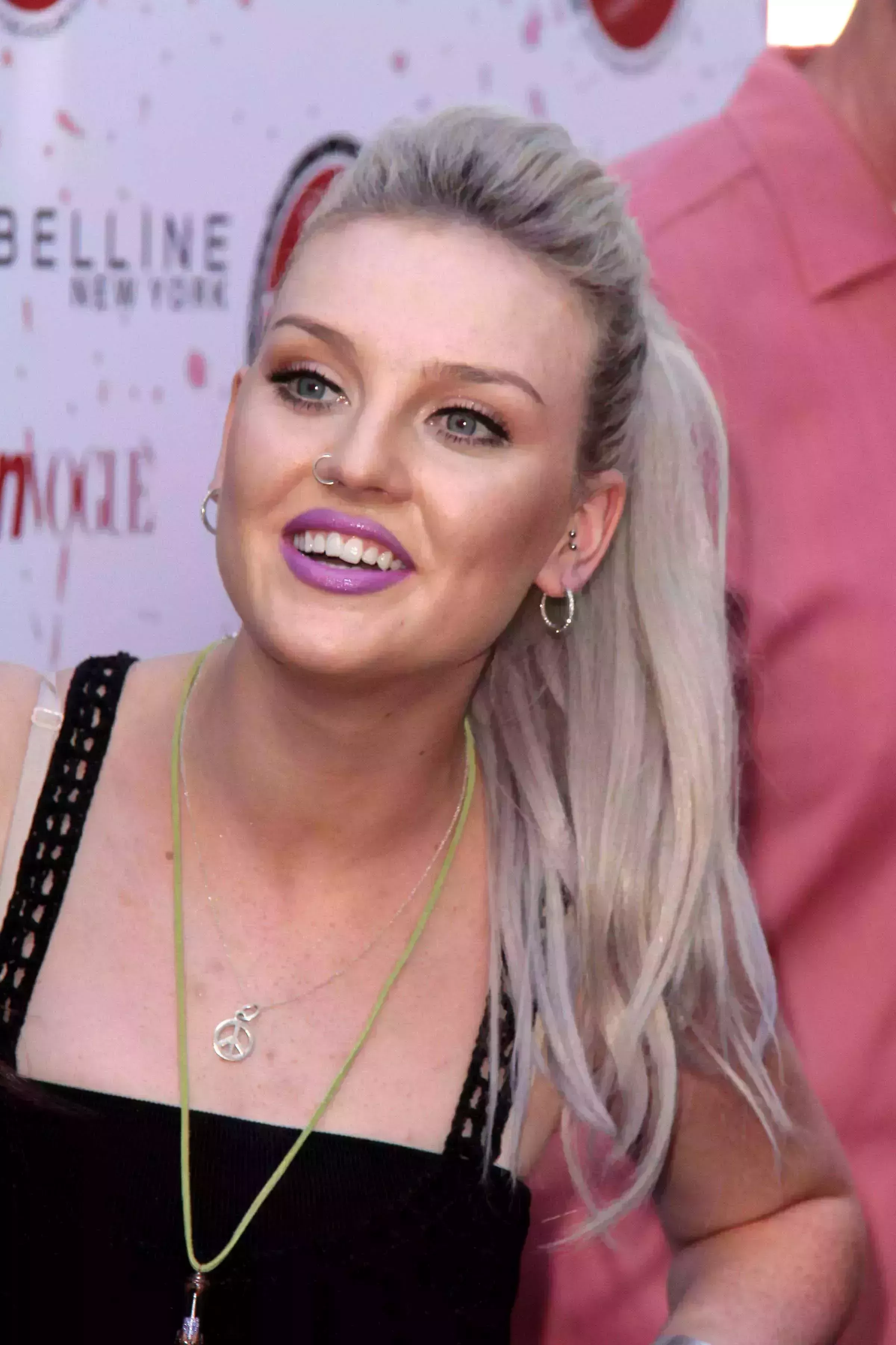 Perrie Edwards’ Ash Blonde Hair with Subtle Purple Highlights