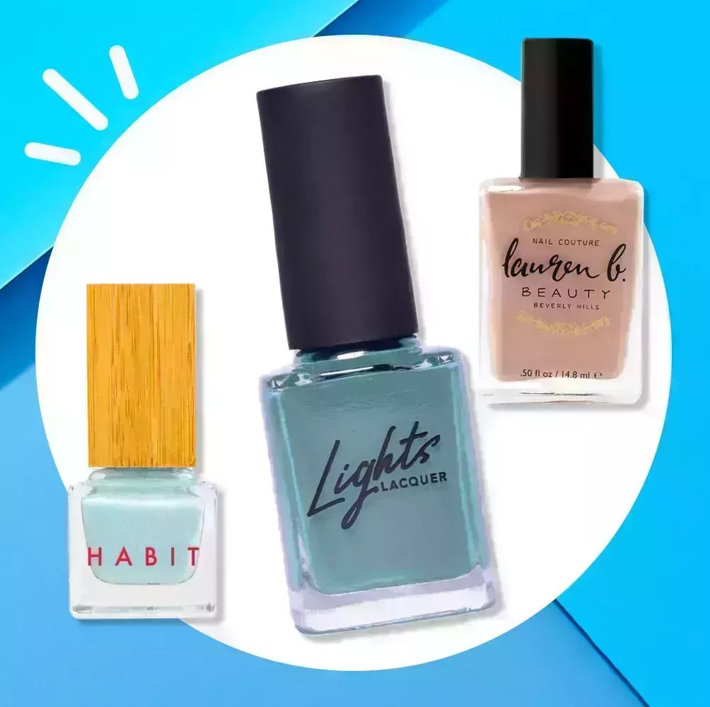 three nail polishes on a blue background