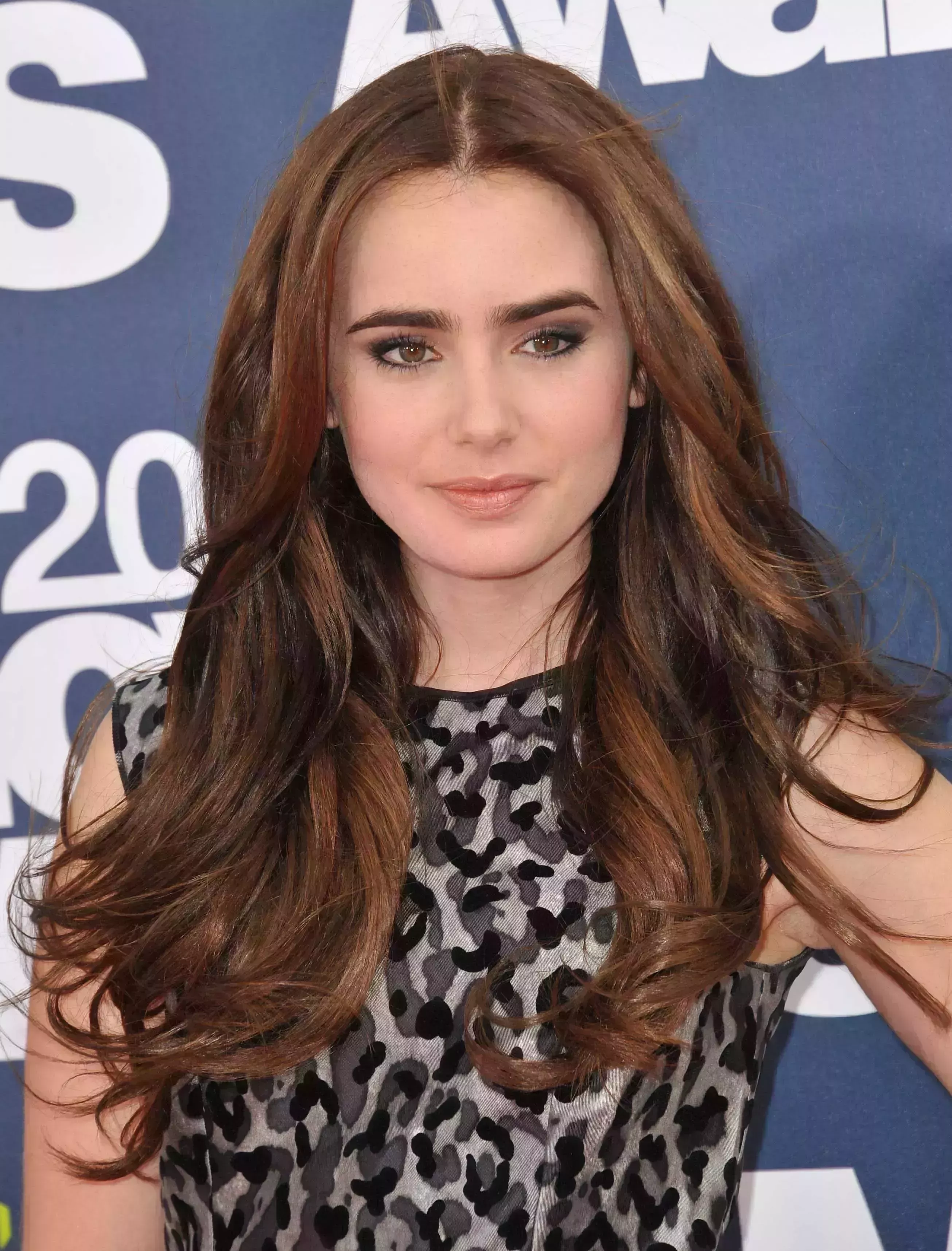 Lily Collin’s long Brunette Lowlights