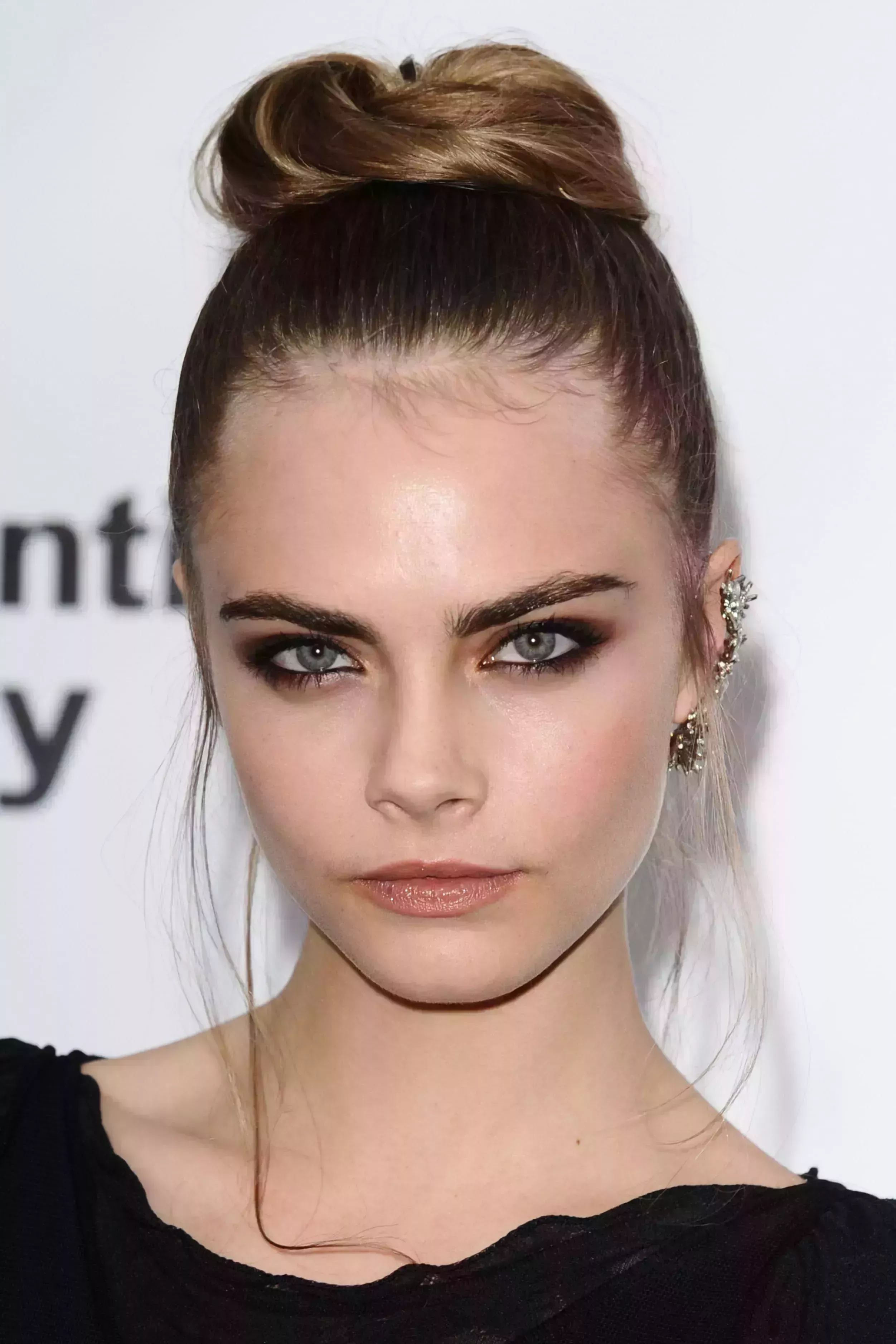 Cara Delevigne’s Sleek Top Bun