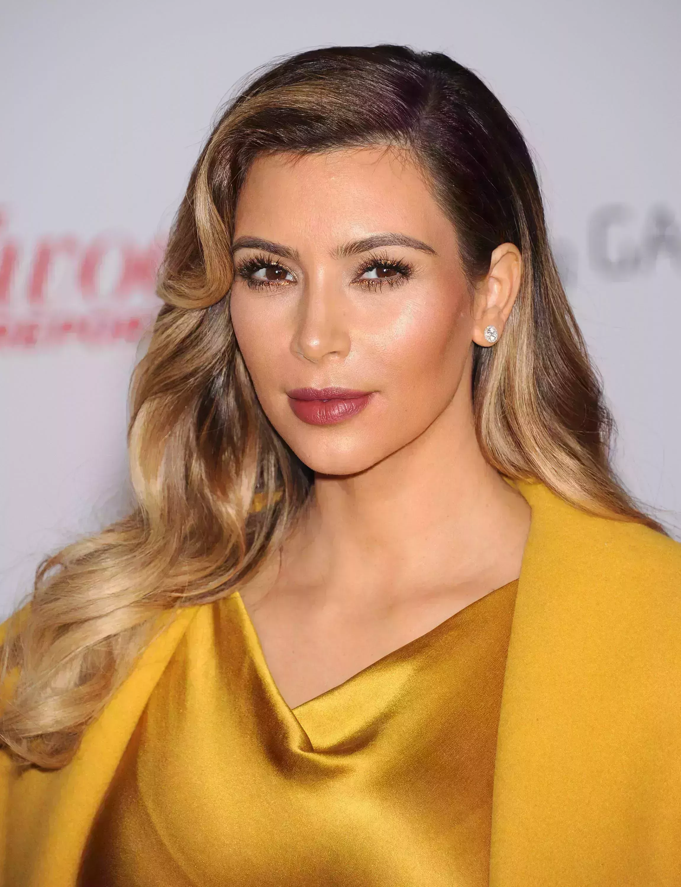 Kim Kardashian’s Chocolate Brown Hair with Chunky Blonde Highlights