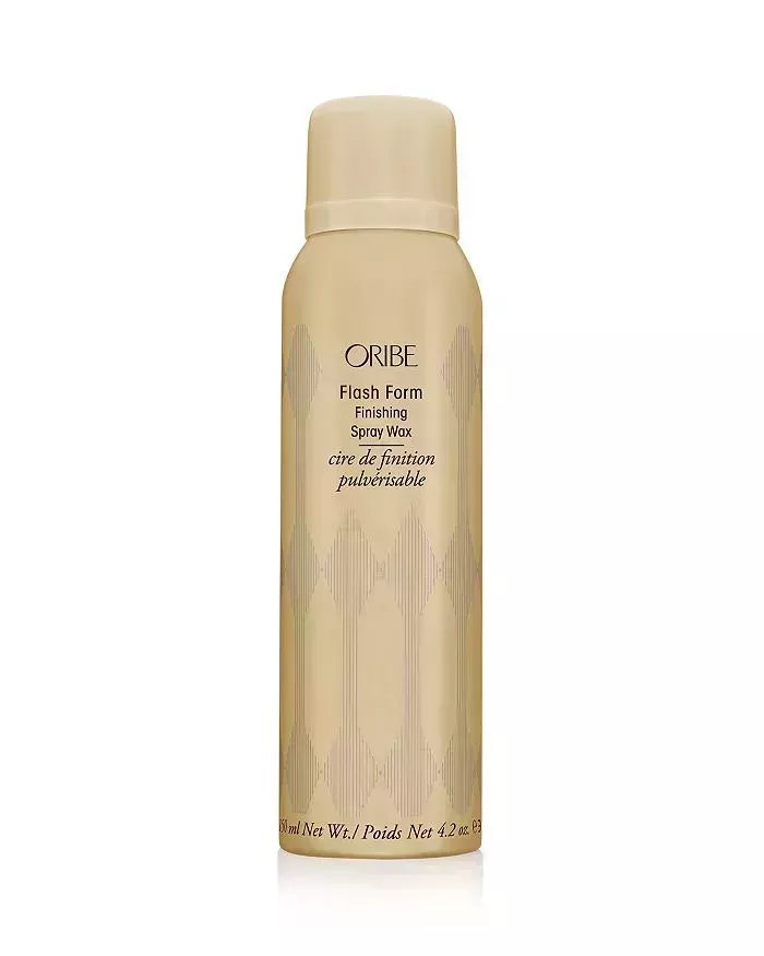 gold bottle of Oribe Flash Form Texturizing Spray Wax on a white background