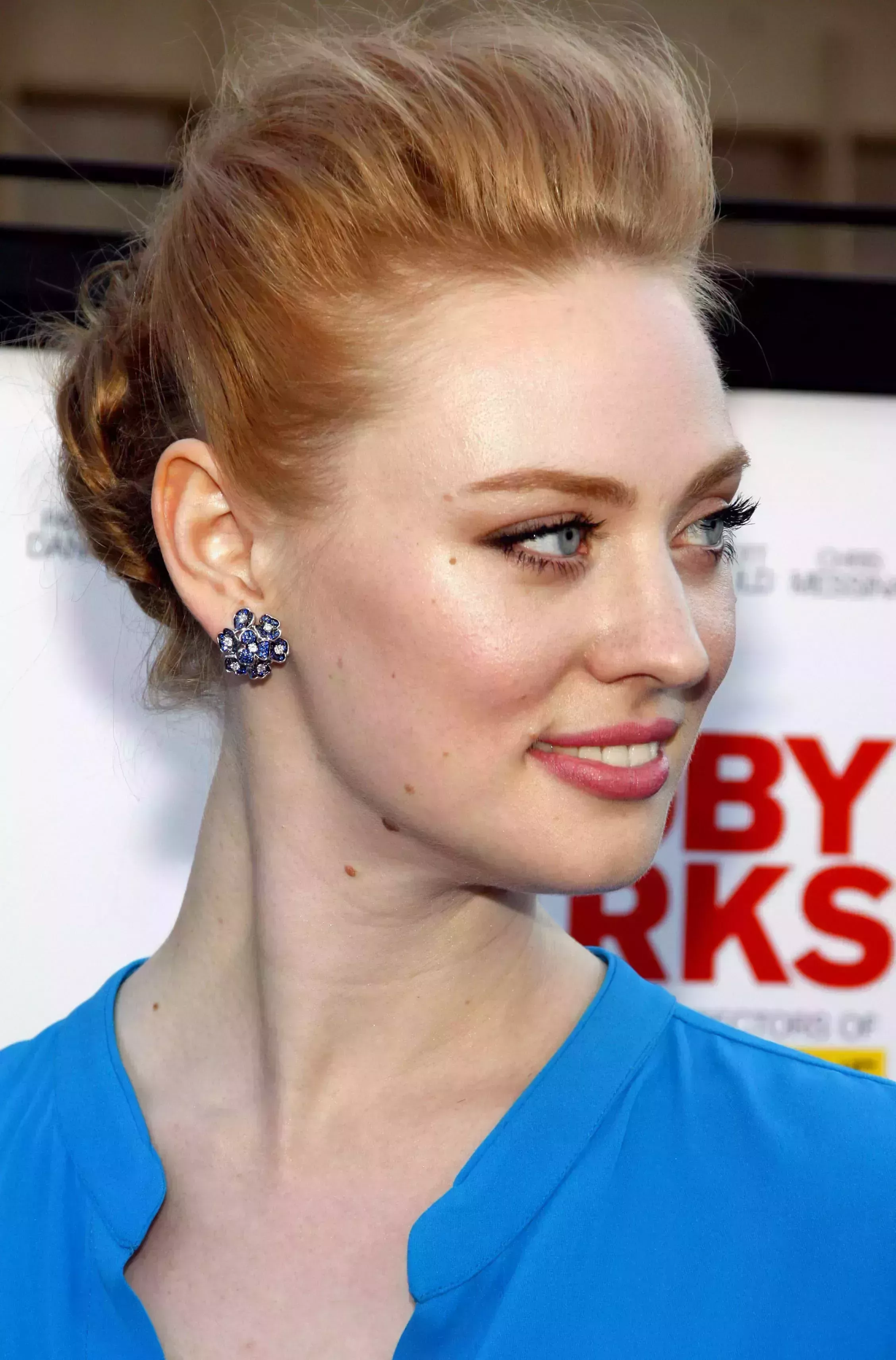 Deborah Ann Woll’s Voluminous Top and Low Bun