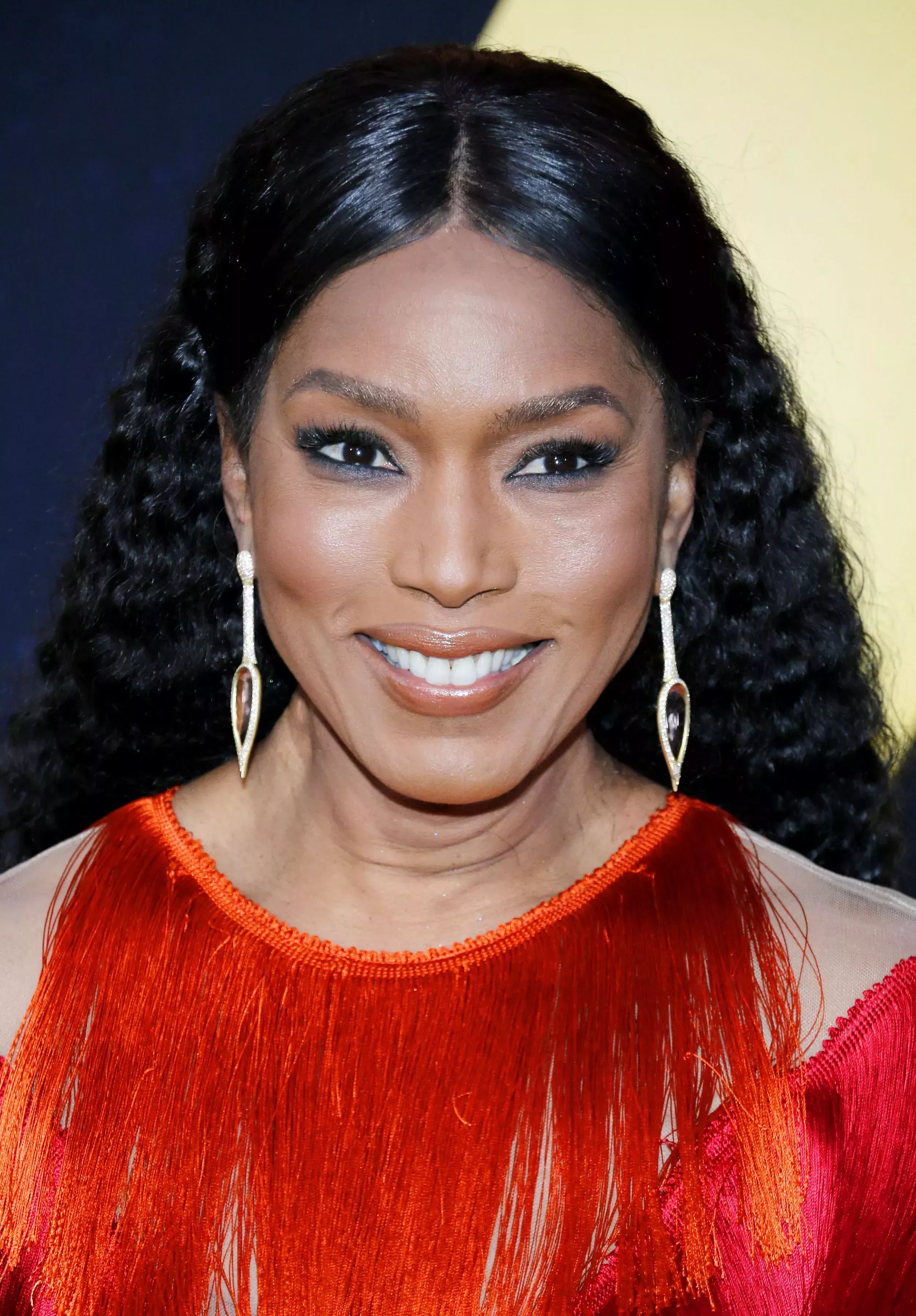 Angela Bassett’s Sleek Center-Parted Curls