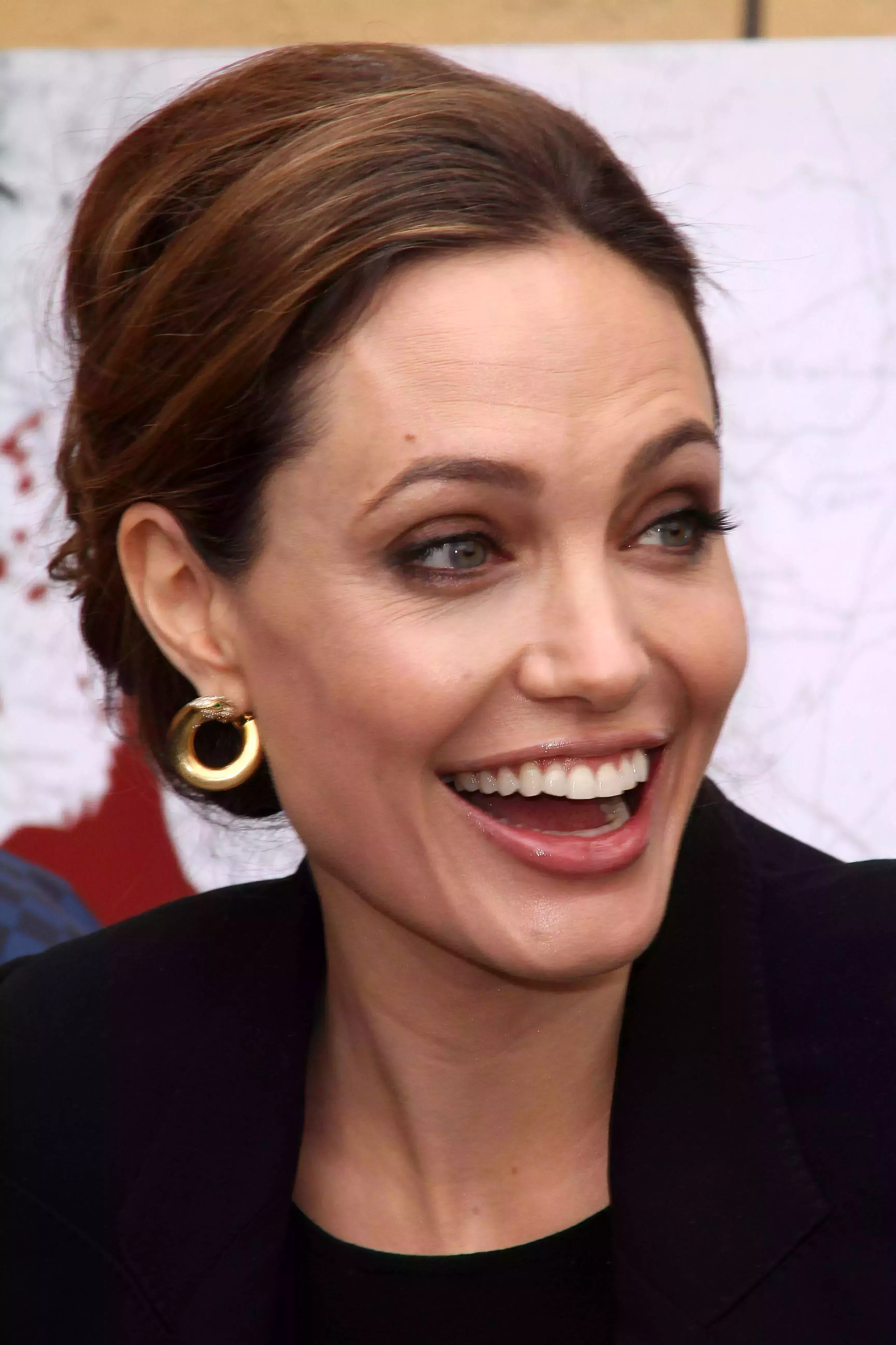 Angelina Jolie’s Ear Tuck Side Part