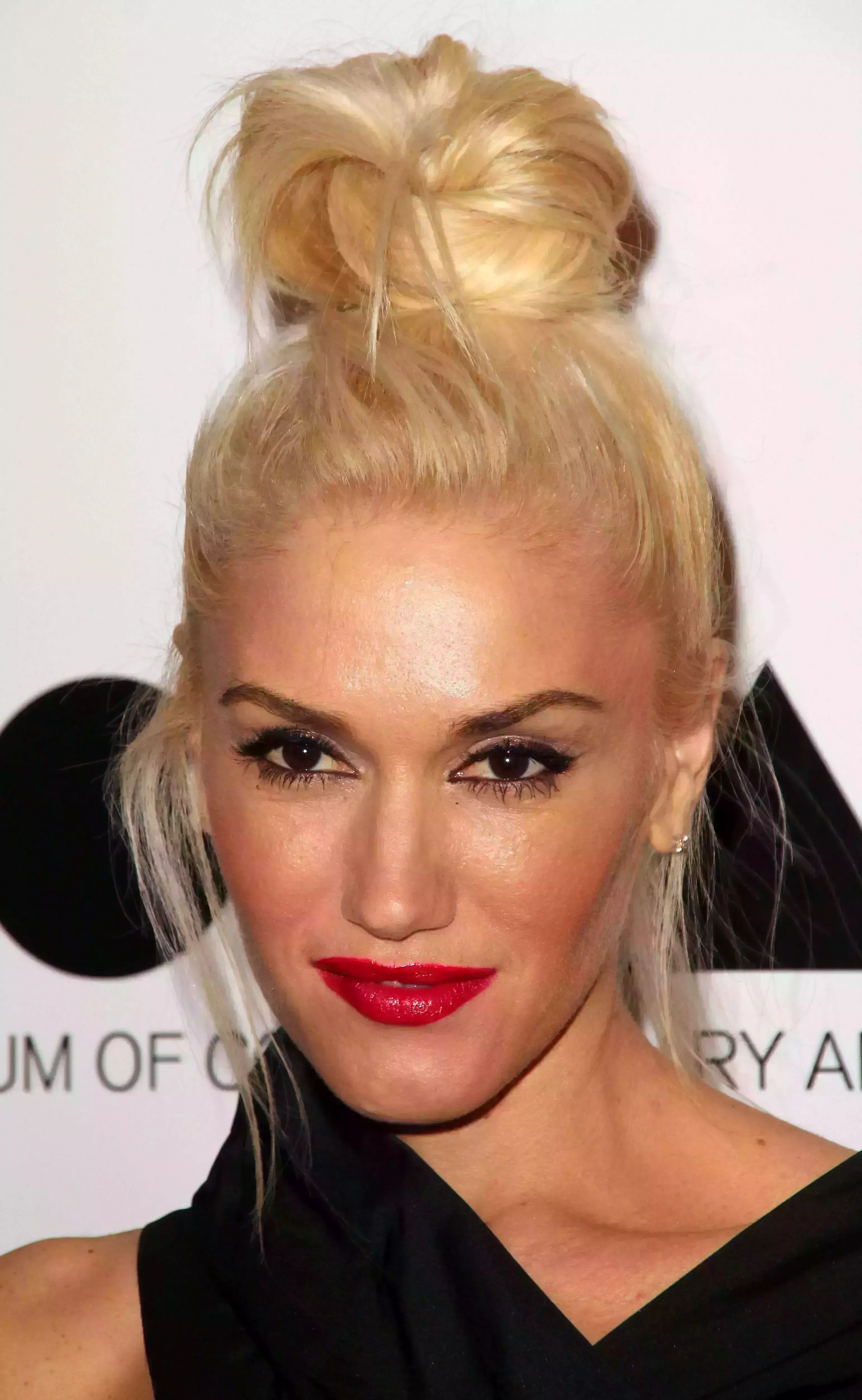 Gwen Pushing all Long Strands to The Bun
