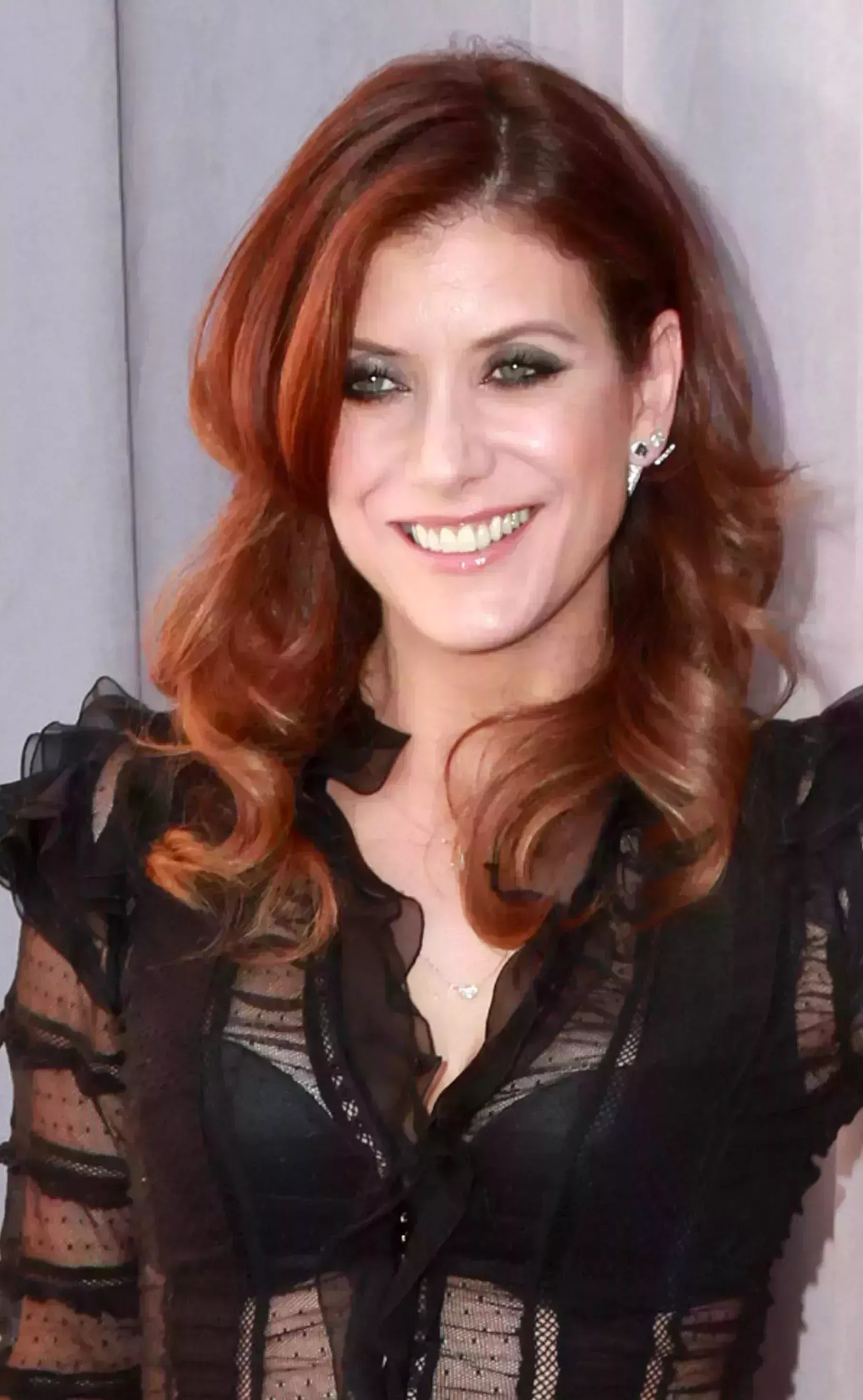 Kate Walsh’s Signature Red Locks