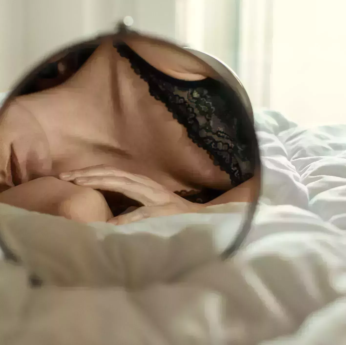 sensual woman relaxing in her bedroom