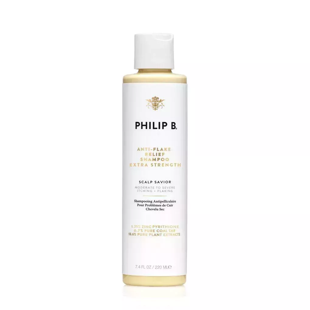 bottle of Philip B Anti Flake Relief Shampoo on a white background