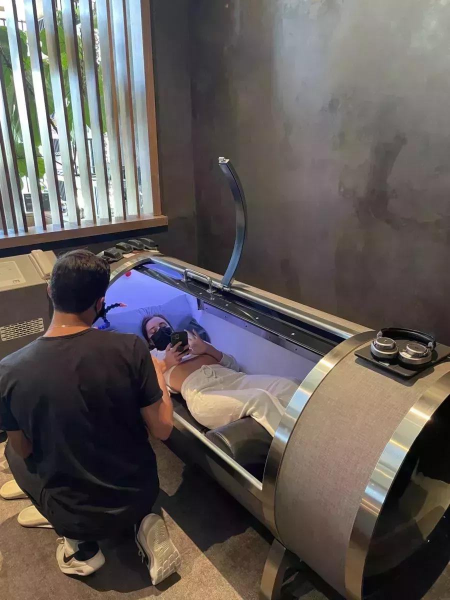 woman inside Hyperbaric Oxygen Chamber