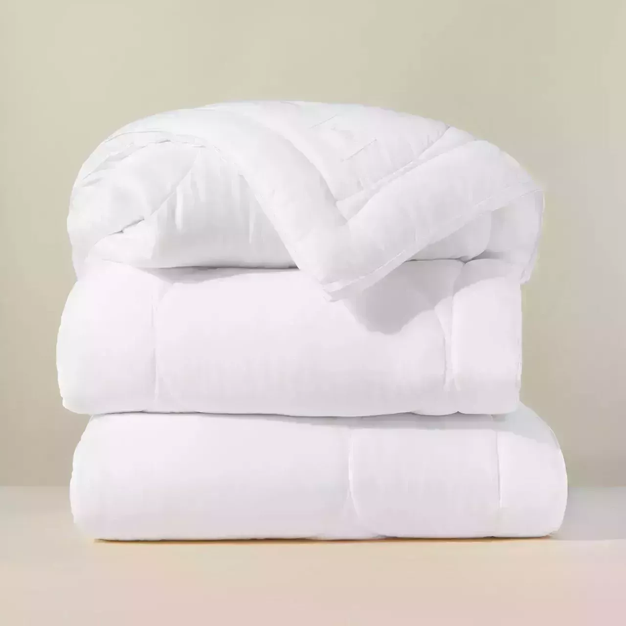 Buffy Cloud Comforter on beige background