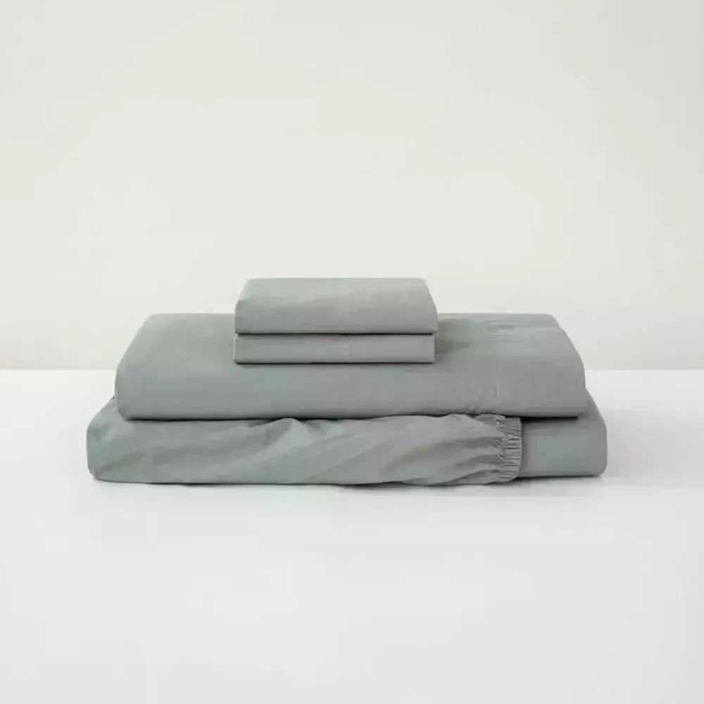 Image may contain: Blanket, Cushion, Couch, and Furniture