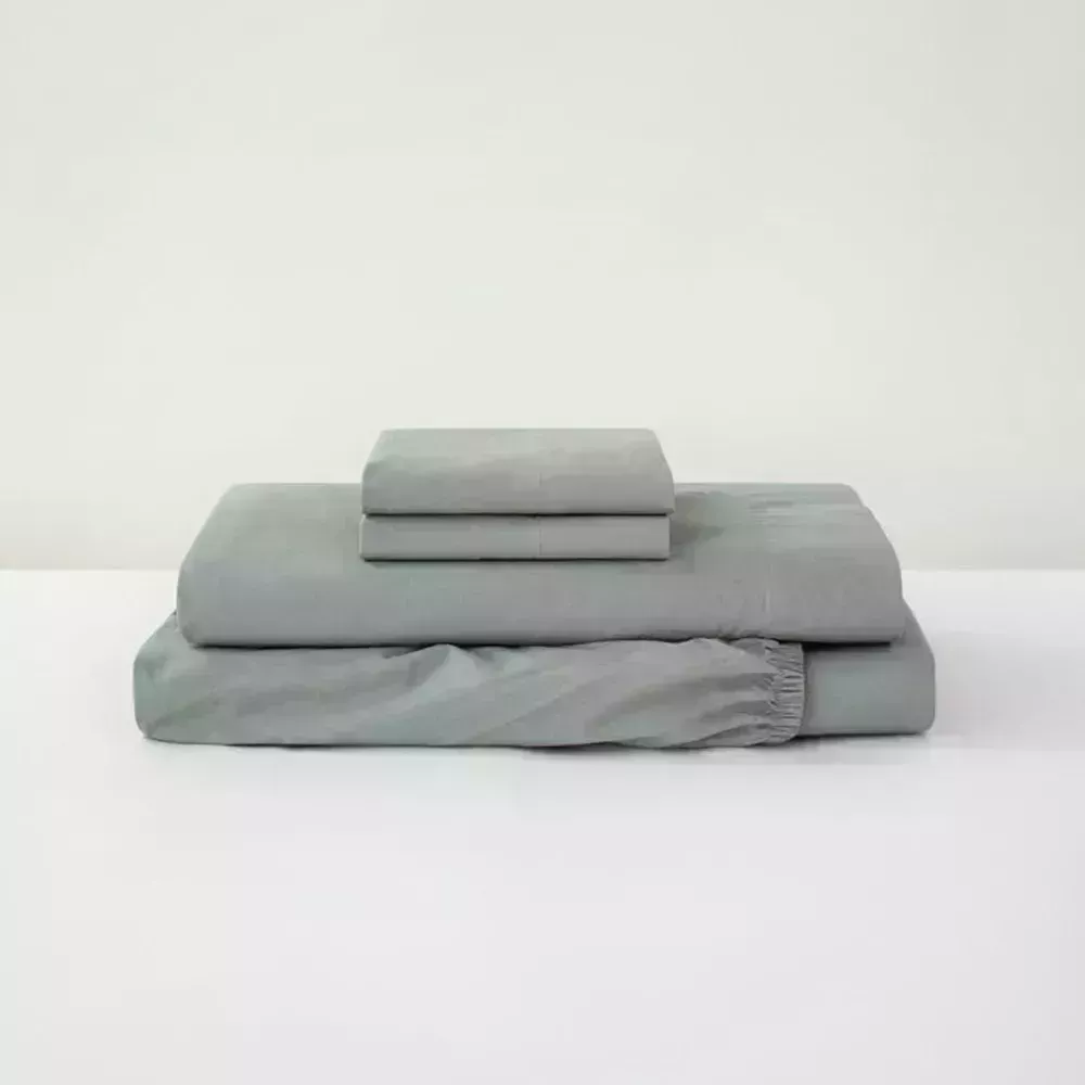 Image may contain: Blanket, Cushion, Couch, and Furniture