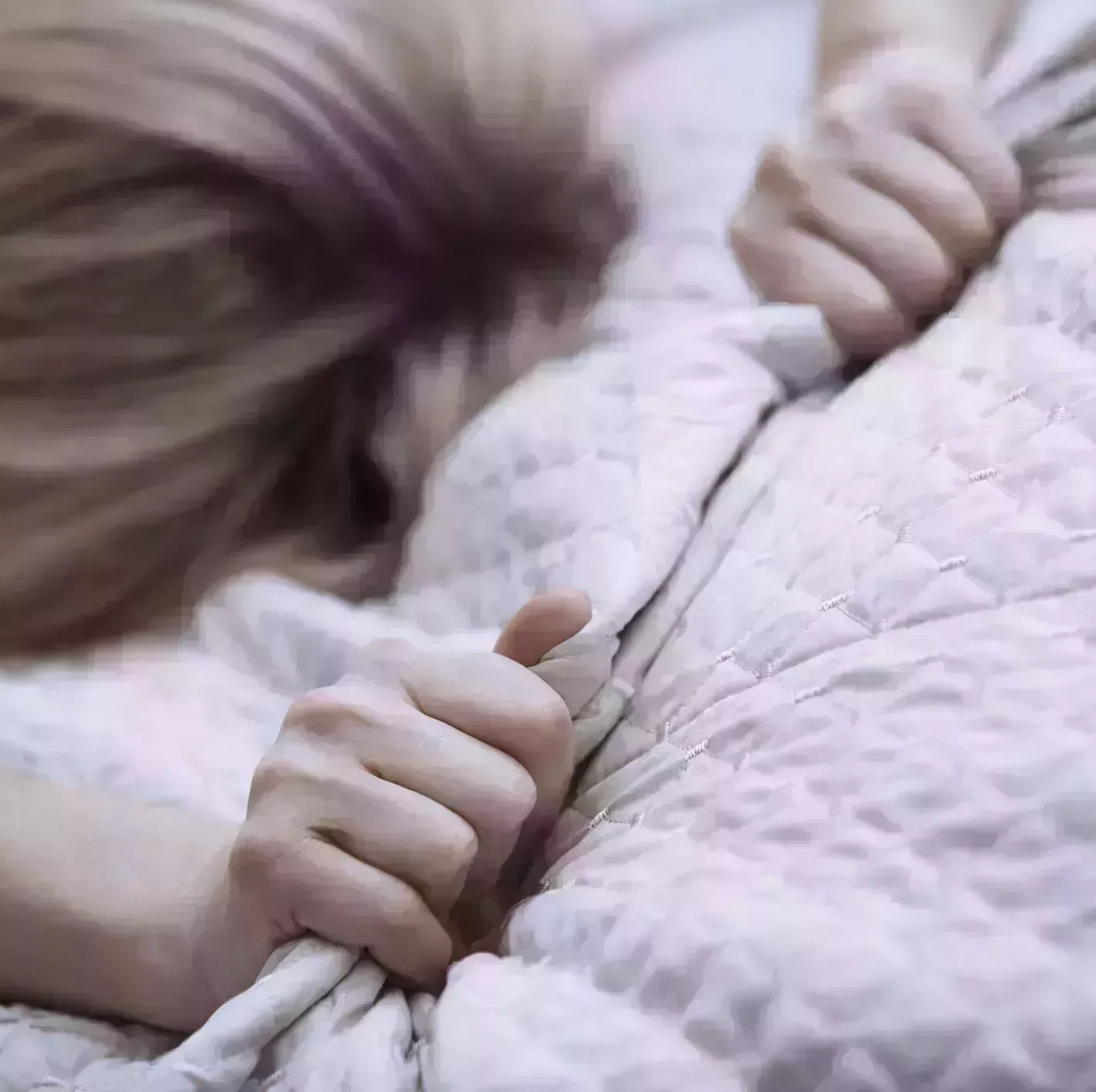 Passionate woman gapping bed linen