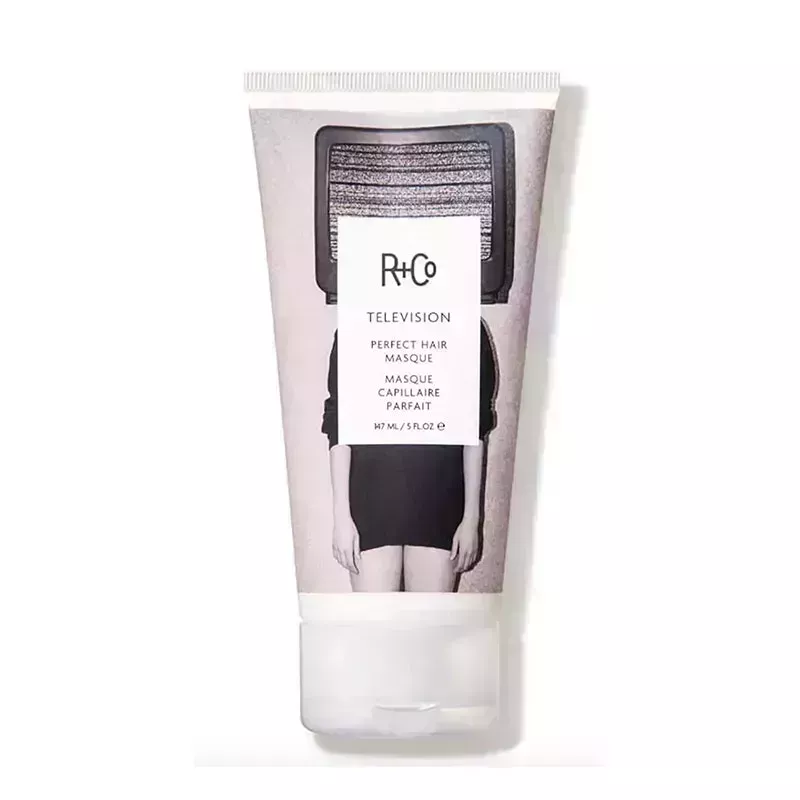 A tube of the R+Co Television Perfect Hair Masque on a white background