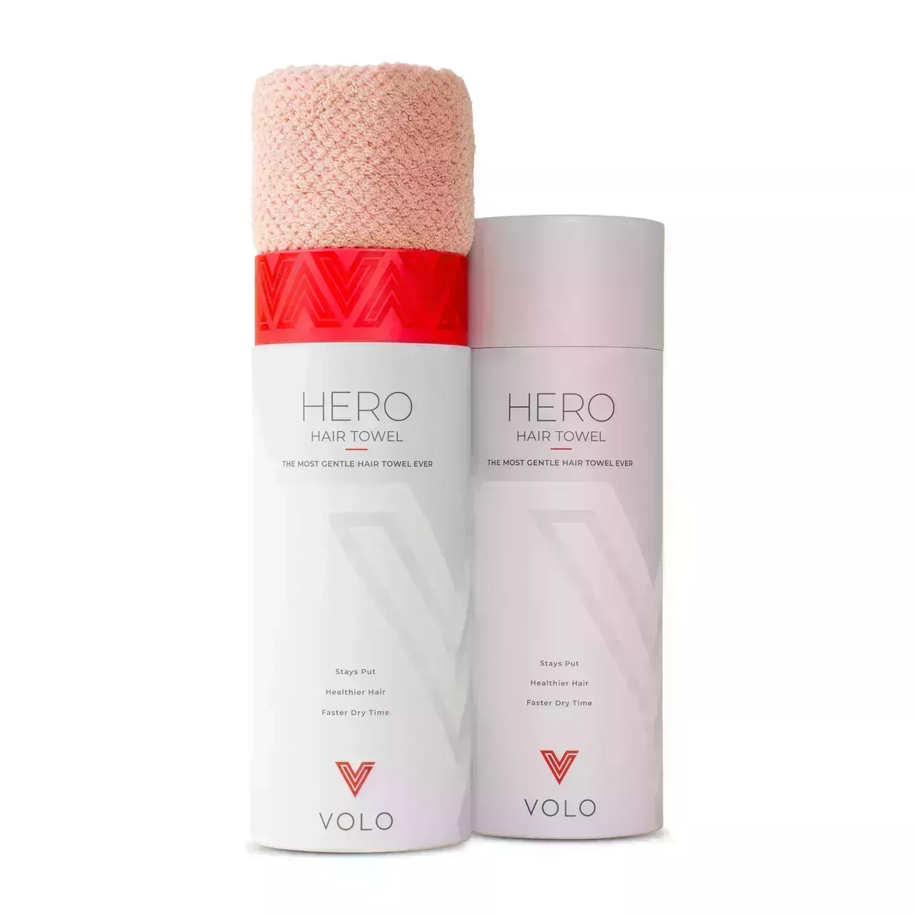 Pale pink Volo Hero Quick Dry Towel sticking out of open tube on white background
