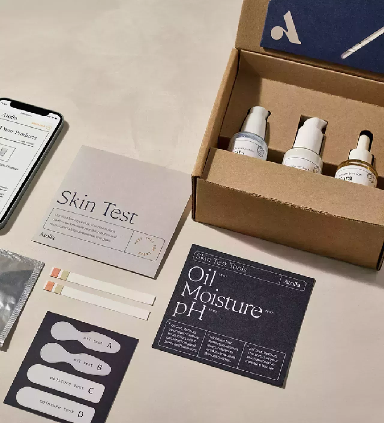 Skin-care serum bottles in box with testing strips and literature