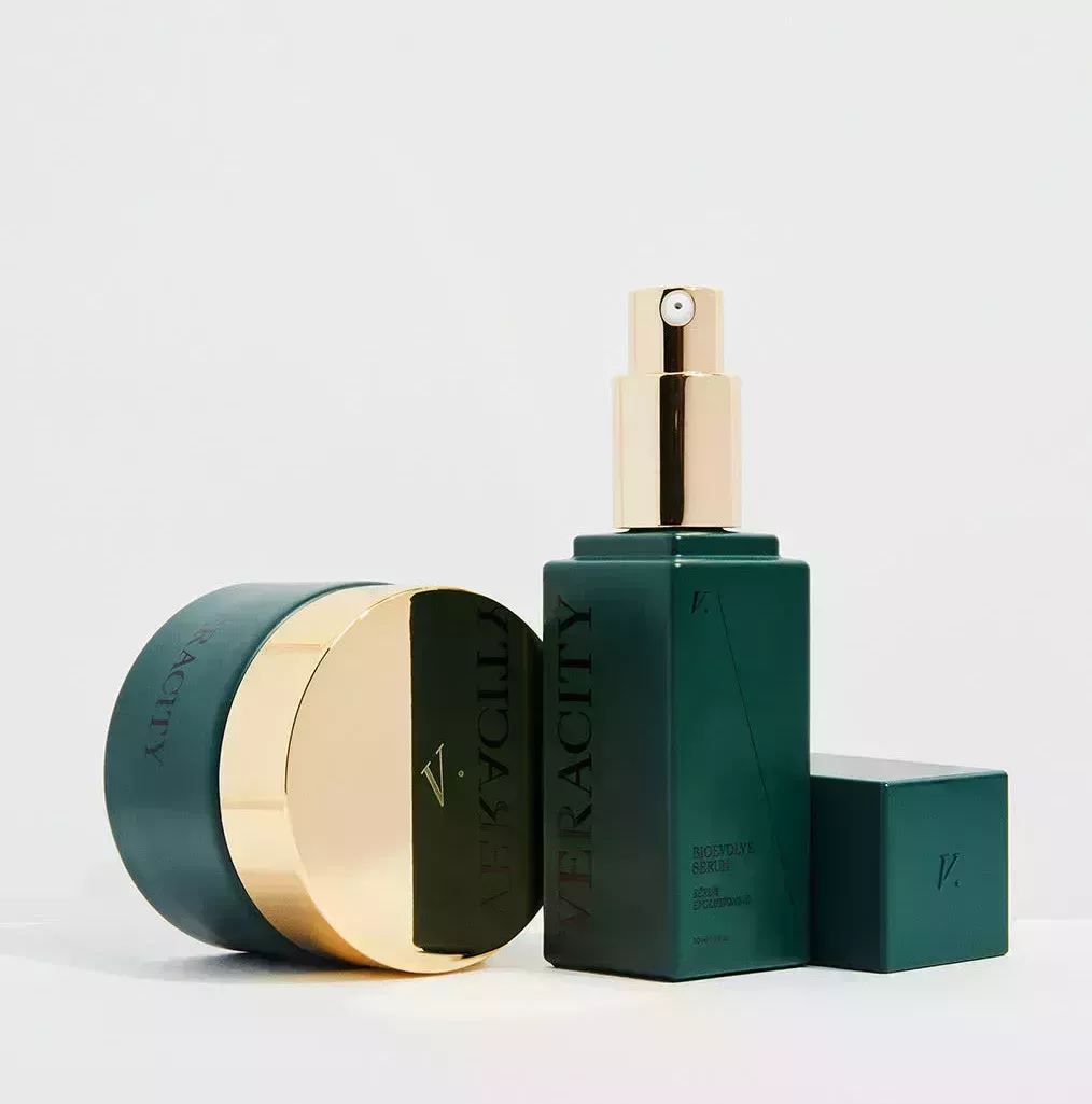 Two green bottles of Veracity Selfcare skin-care products