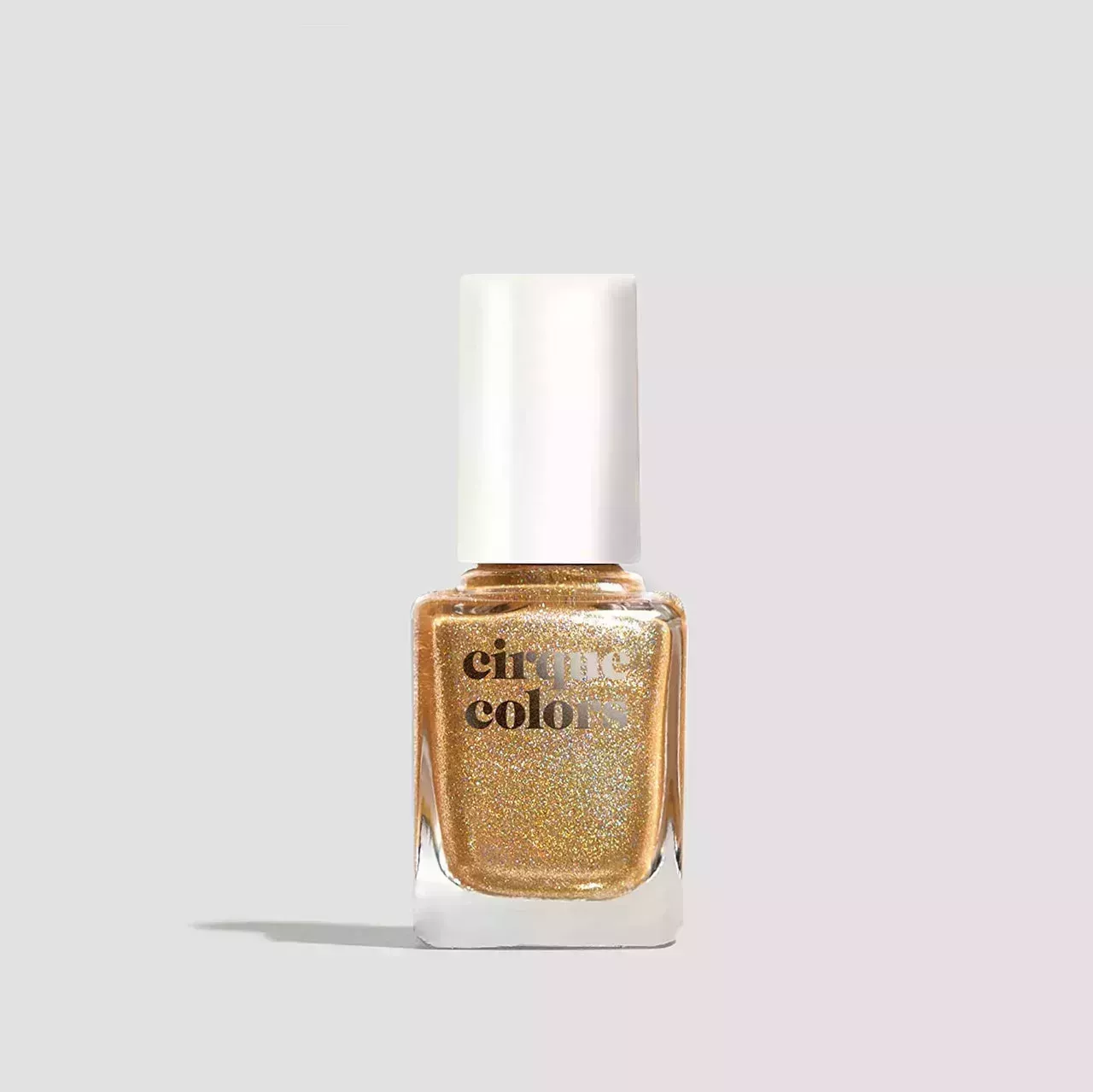 Cirque Colors 24K Affair gold nail polish against a white background. 