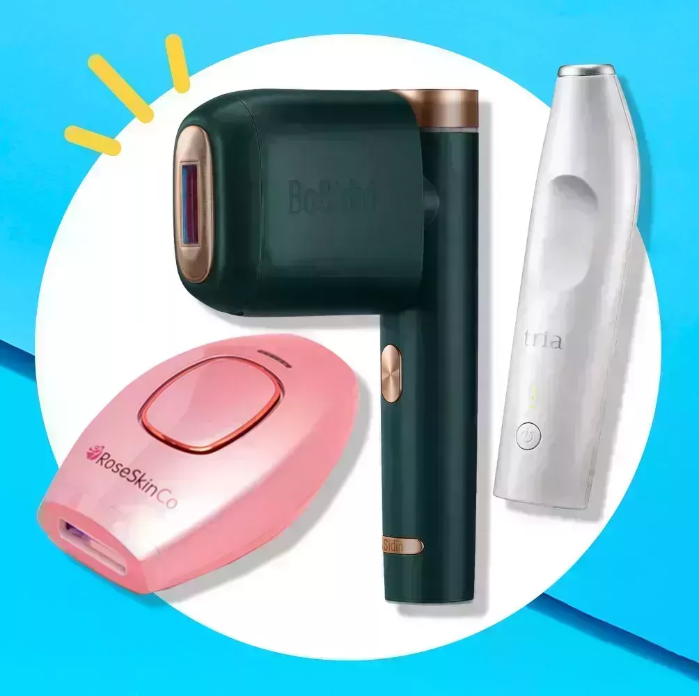 three athome laser hair removal devices, one pink one, a green and gold one, and a small, travelfriendly white one
