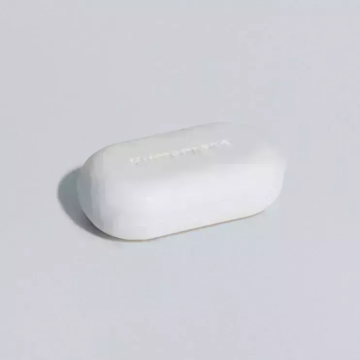 Humanrace Reenergizing Whiteclay Body Bar on light gray background