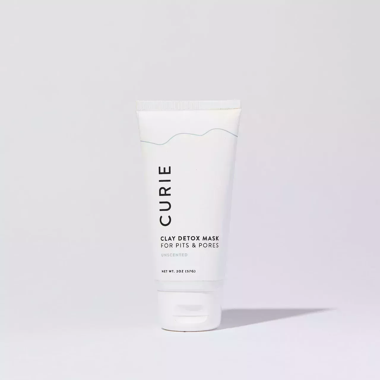 bottle of curies clay detox mask for armpits on a gray background