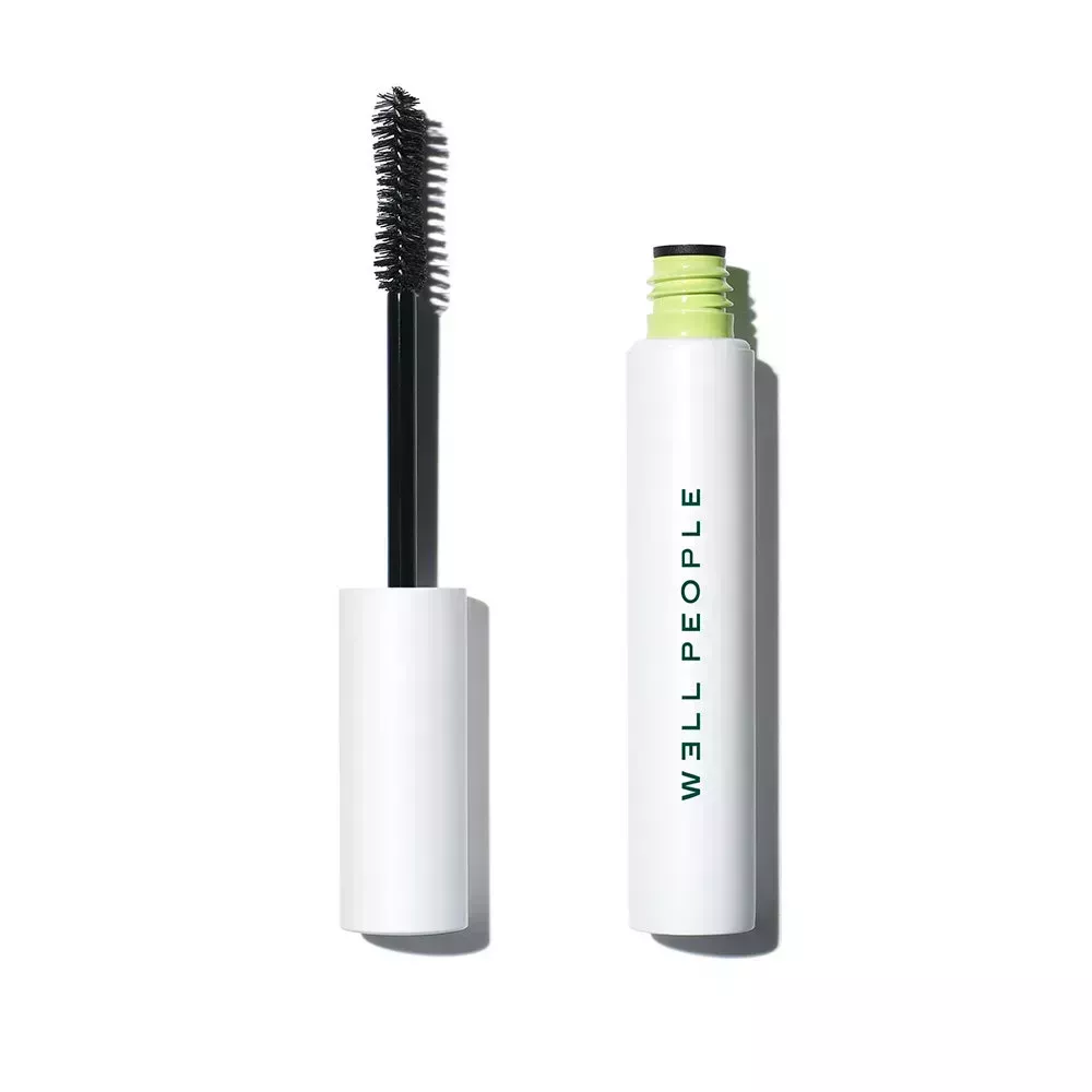 W3LL People Expressionist Volumizing Mascara open with mascara wand on white background